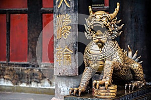 Statue of mystical Chinese guardian lion in Wenshu Temple.