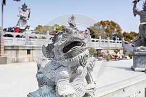 Statue of the mythological animal in front of Golden statue of bodhisattva guanyin Mount Luojia, Zhoushan, Zhejiang, the place