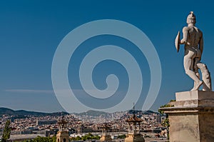 Statue of a naked gladiator at Square of Cascades in Barcelona, Spain, blue sky