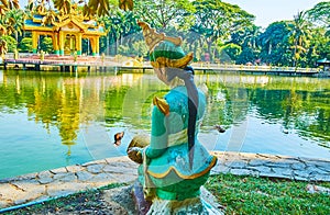 Nat statue in Theingottara park, Yangon, Myanmar photo
