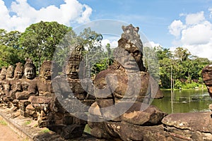 Statues near South gate of Angkor Thome photo
