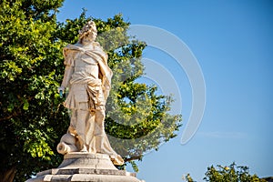 Statue next to Old Venetian fortress and Hellenic temple at Corfu, Ionian Islands, Greece
