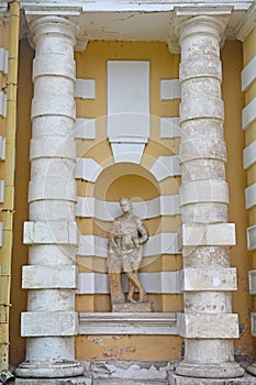 Statue in a niche between columns of Grotto in Kuskovo estate in Moscow