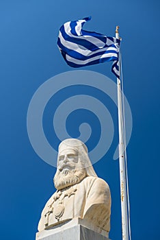 Statue Of Nikos Kazantzakis With Waving Greek Flag