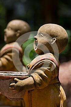 Statue of novices in Wat Umong Chiang Mai. Thailand