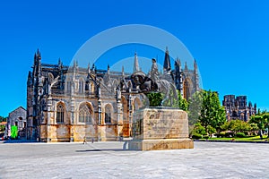 Statue of Nuno Alvares Pereira and Batalha monastery in Portugal