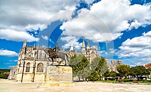 Statue of Nuno Alvares Pereira with Batalha Monastery in Portugal