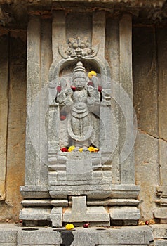 Statue and offerings photo