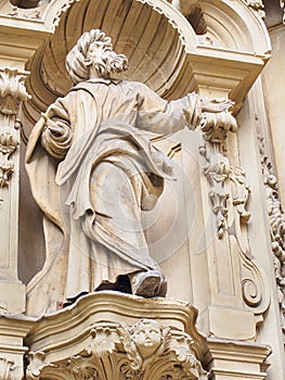 Statue of old-aged bearded man on the facade of The Basilica of Saint Mary of Coro in San Sebastian