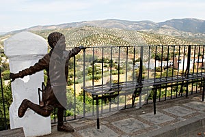 Statue and olive groves, Priego de Cordoba. photo