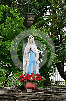 Statue of Our lady of grace virgin Mary view with natural background in the rock cave at Thailand
