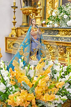 statue of Our Lady of Praia das MaÃ§Ã£s inside the Igreja Matriz de Colares Nossa Senhora da AssunÃ§Ã£o photo