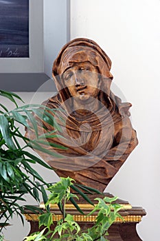 Statue of Our Lady of Sorrows on the altar of St Joseph in the Good Shepherd Church in Brestje, Croatia photo