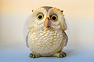 Statue of an Owl isolated on bright background