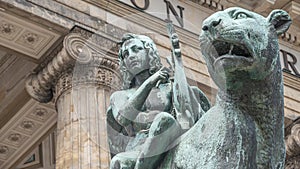 Statue of a panther with genius of music, an angel with wings and a harp, stringed musical instrument at Concert Hall Konzerthaus