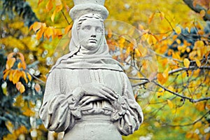 Caryatid. Statue in the Herastrau Park, on autumn background - landmark attraction in Bucharest, Romania