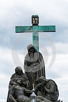 The statue of PietÃ , Lamentation of Christ on Charles Bridge ,  is an outdoor sculpture by Emanuel Max, installed on the south