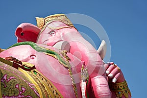 Statue of Pink Ganesha,Hindu god of wisdom or prophecy, on blue sky background