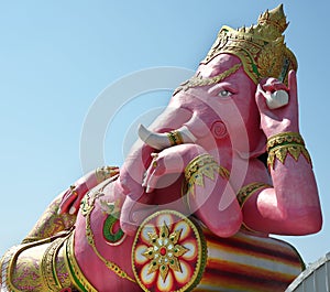 Statue of Pink Ganesha,Hindu god of wisdom or prophecy, on blue sky background