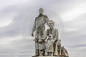 A statue of a Polish immigrant family on the foreshore in HUll