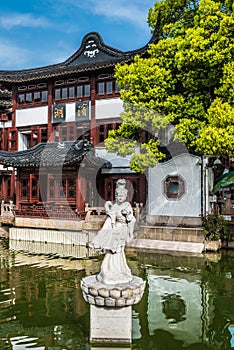 Statue on a pond in Fang Bang Zhong Lu old city shanghai china