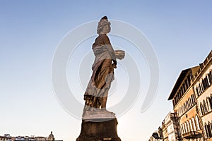 A statue at the Ponte Santa Trinita bridge in Florence, Italy