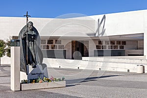 Statue of Pope John Paul II with the Basilica of Most Holy Trinity in background