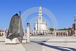 Statue of Pope John Paul II with Our Lady of the Rosary Basilica in background