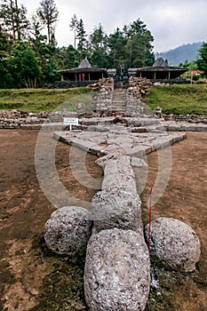 Statue and Prayer Incense or Sesajen Inside Cetho Temple at Karanganyar Tawangmangu Central Java Indonesia photo
