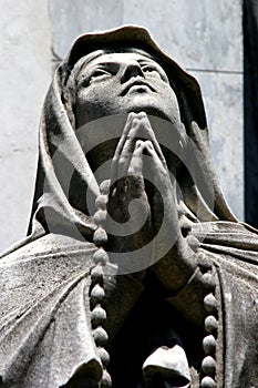 Statue of a praying person photo