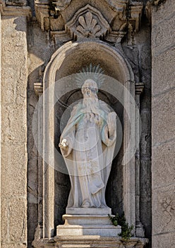 Statue of the Prophet Elisha on the right side of the entrance to the Carmo Church in Porto, Portugal. photo