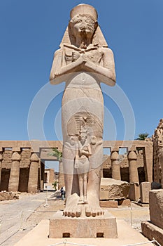 The statue of Ramses II with his daughter Merit-Amon in the temple of Amun-RA in Karnak, Luxor, Egypt