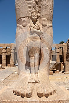 The statue of Ramses II with his daughter Merit-Amon in the temple of Amun-RA in Karnak, Luxor, Egypt