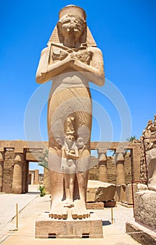 Statue of Ramses II with his daughter Merit-Amon in the temple of Amun-RA (the temple of Karnak in Luxor)