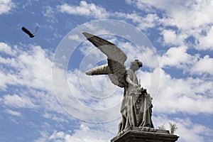 A statue in Recoleta`s cemetery in Buenos Aires photo