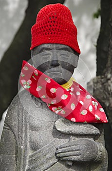 Statue with red cap and scarf