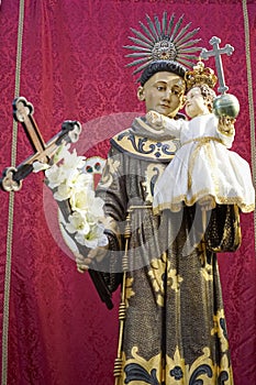 statue of the representative figure of Santo AntÃ³nio inside the cathedral of SÃ© de Lisboa photo