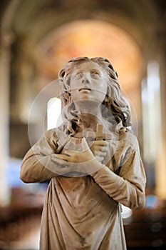 Statue representing Faith in Trento Cathedral photo