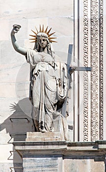 Statue representing the New Law on the Milan Cathedral's facade photo