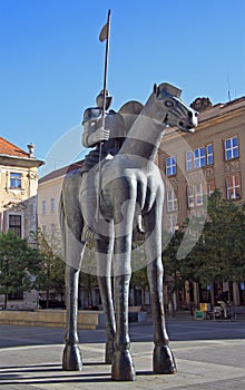 Statue of rider on horse with disproportionate legs