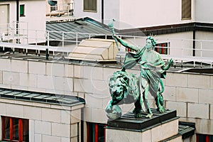 Statue on roof of entrance to the bank Czech