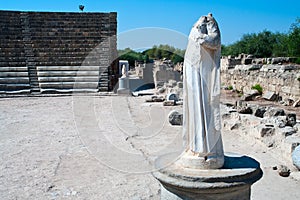 Statue in ruins of ancient theater in Salamis