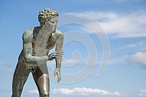 A statue of 'The Runner' in the garden of Achilleion in Corfu.