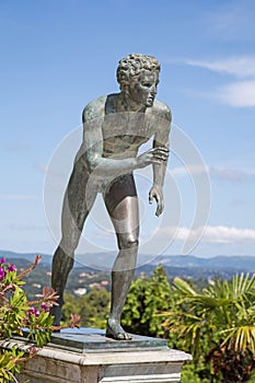 A statue of 'The Runner' in the garden of Achilleion in Corfu.
