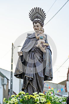 statue of saint Antonio parading on top of a religious litter in Malpica do Tejo