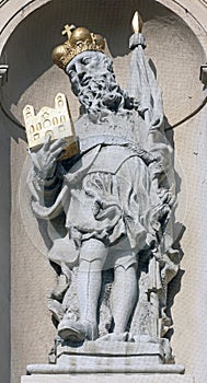 Statue of Saint on baroque Jesuits church in Vienna photo