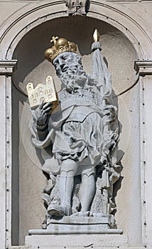 Statue of Saint on baroque Jesuits church in Vienna photo