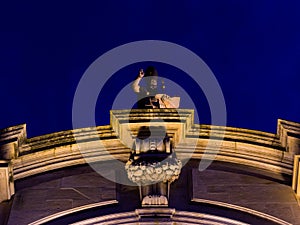 Statue of Saint Blaise on top of St Blaise`s Church in Dubrovnik illuminated during summer night