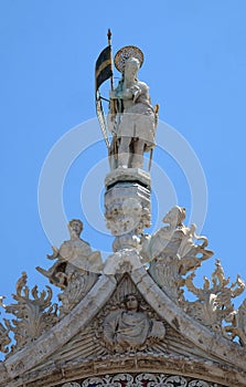 Statue of Saint, detail of the facade of the Saint Mark`s Basilica in Venice
