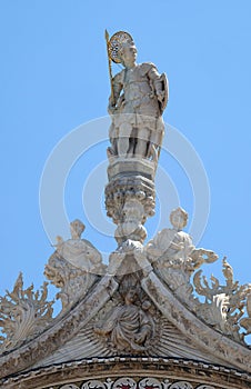 Statue of Saint, detail of the facade of the Saint Mark`s Basilica, Venice